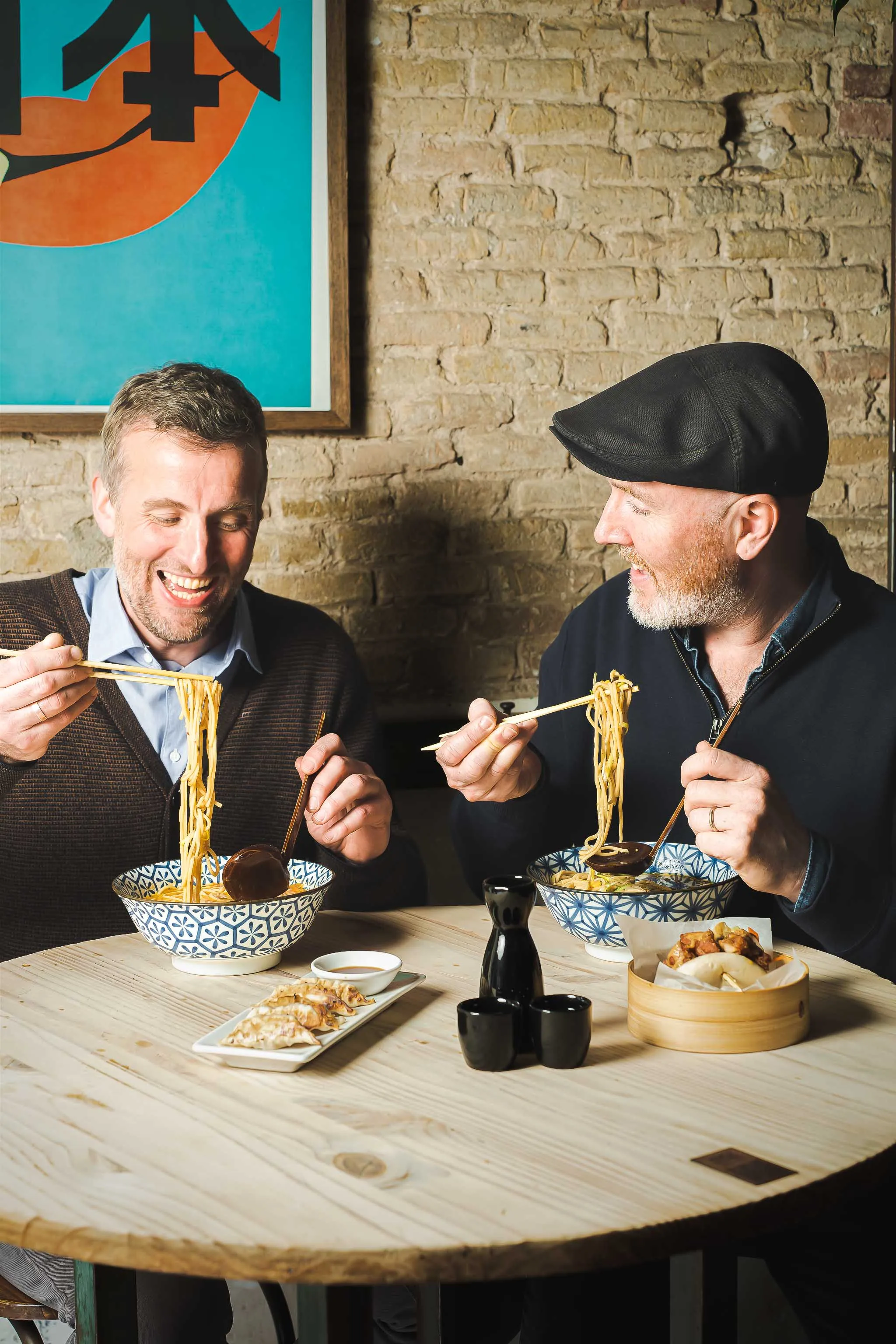 The owners, Ross and Mark, enjoying their bowls of ramen and having a good time
