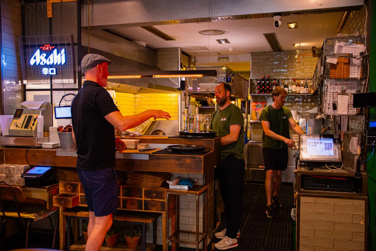 The team at work in the open kitchen of Koku Kitchen El Born