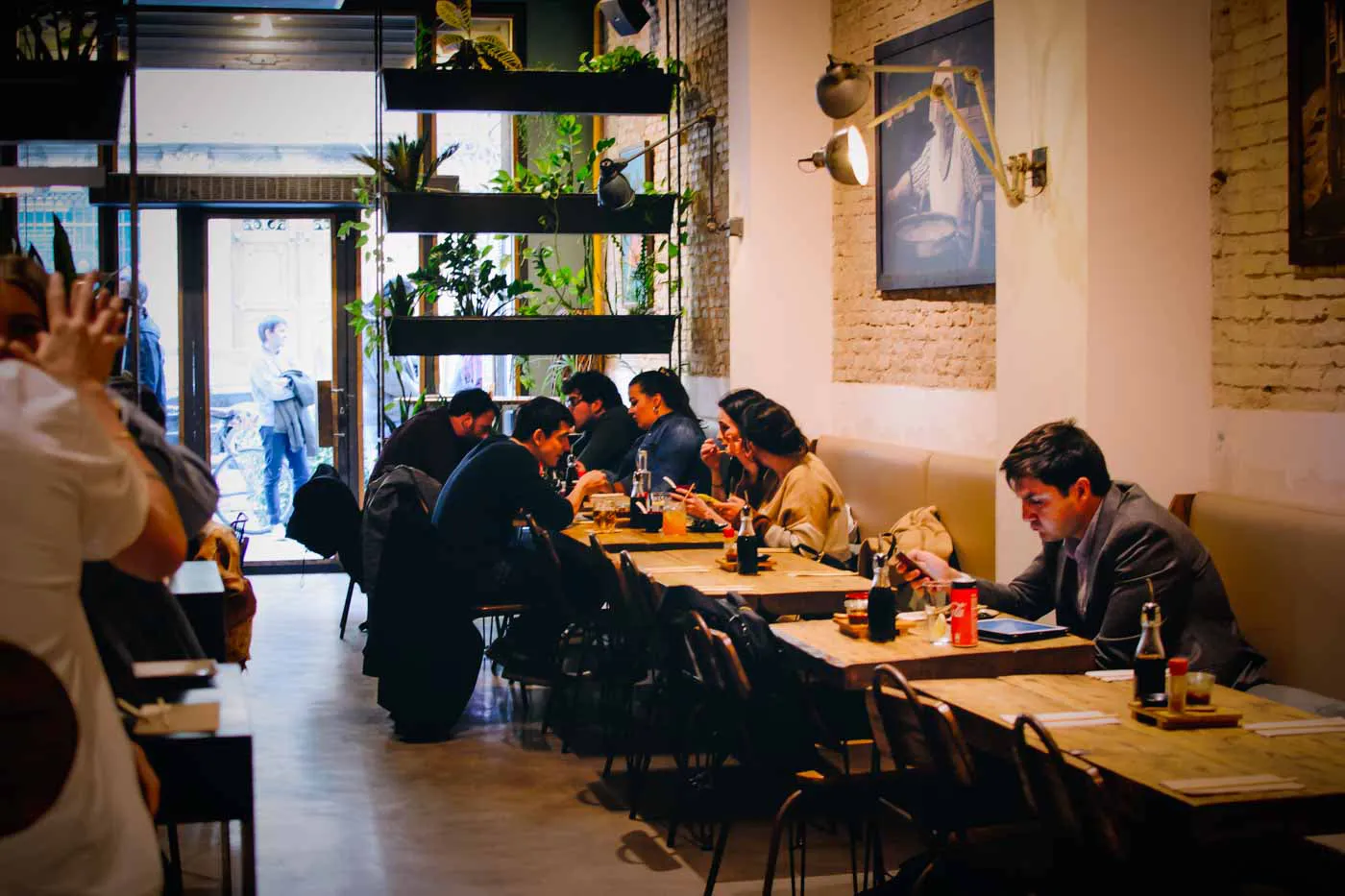 Guests eating in the dining room of Koku Kitchen El Born